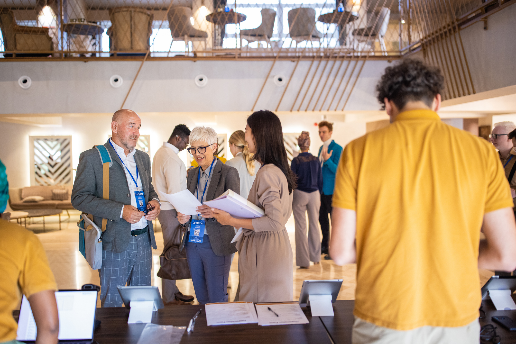 A group of business conference participants socializing before the congress begins